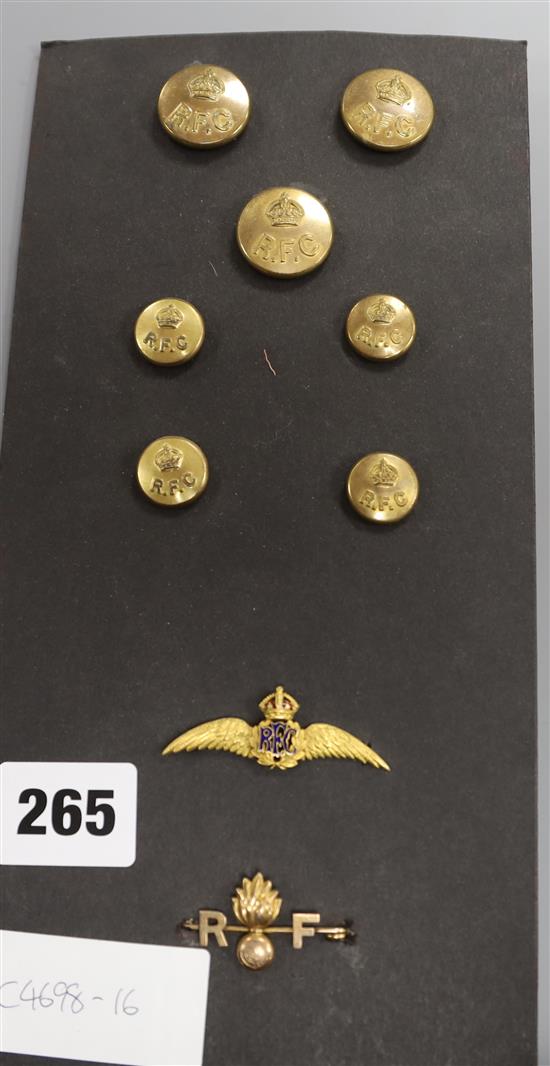 An RFC gold brooch, an Royal Fusiliers gold brooch and seven buttons